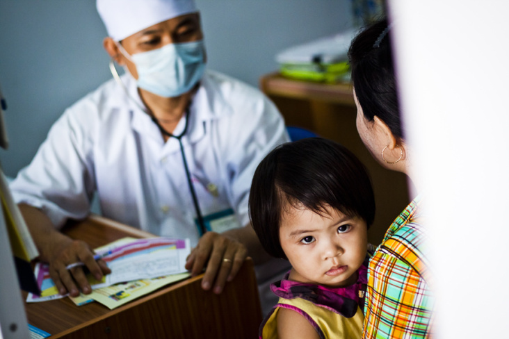 A child has a health check at a health clinic sponsored by UNICEF