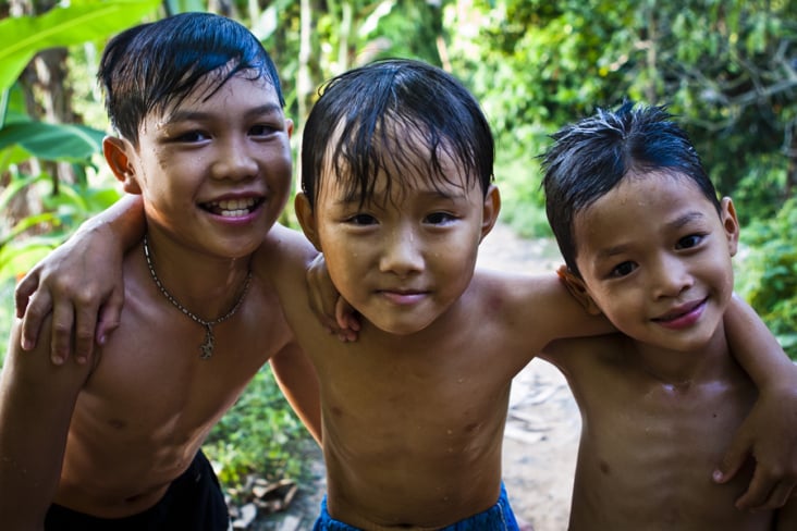 Local boys after swimming in a stream on the Mekong Delta