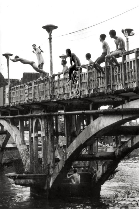 Youngsters jumping from an old Chinese Bridge – Ho-Chi-Minh-City/Saigon – Vietnam