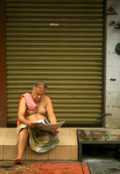 man reading newspaper