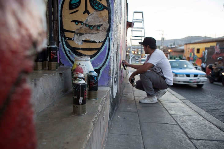 Streetartist Yescka at work/ Oaxaca, Mexico 2013