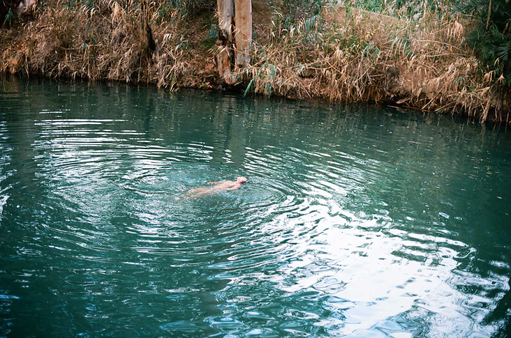 Women floating in Jordan River