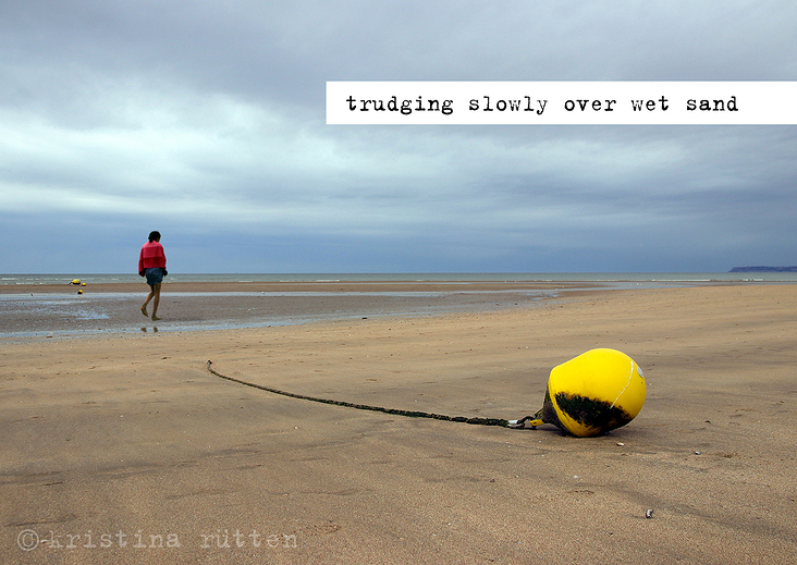trudging slowly over wet sand