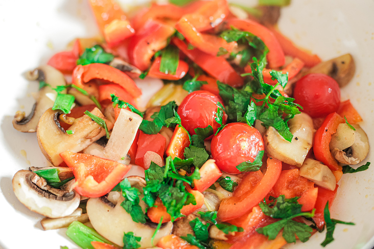 Fresh vegan fried vegetables in the pan.