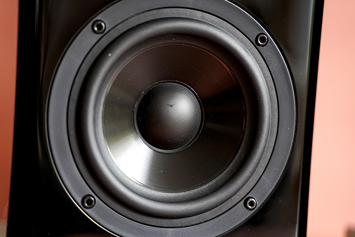 A black, high quality loudspeaker box against a colored background – 2.