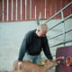 Organic farmer – Hand feeding young calf – Sweden
