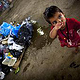 refugee kid in a shabby illegal refugee camp