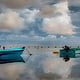 Fishing Boat at the mirror Sea