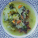 A vegan vegetable soup with sesame seeds.