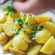 Boiled potatoes are sprinkled with parsley.