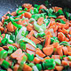 Sliced carrots and leeks steamed in the pan.