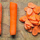 Different stages of a carrot. Unpeeled. peeled and cut. Trinity.