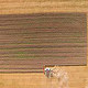 Ein Mähdrescher der Firma Claas während der Ernte auf einem Getreidefeld.